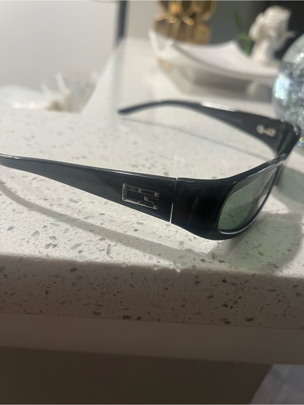 Gucci Black Frame Sunglasses with Green Lenses